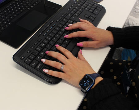 Hands Typing On Computer Keyboard