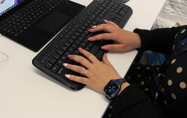 Hands Typing On Computer Keyboard