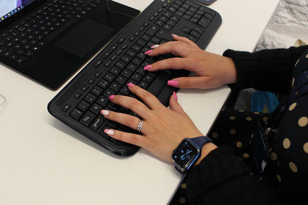 Hands Typing On Computer Keyboard
