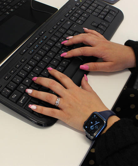 Hands Typing On Computer Keyboard