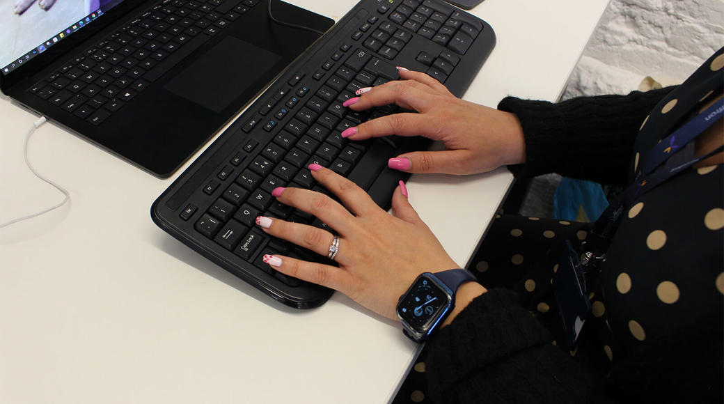 Hands Typing On Computer Keyboard