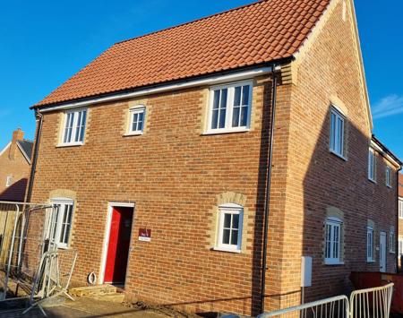 Yellow Brick House With Red Door 