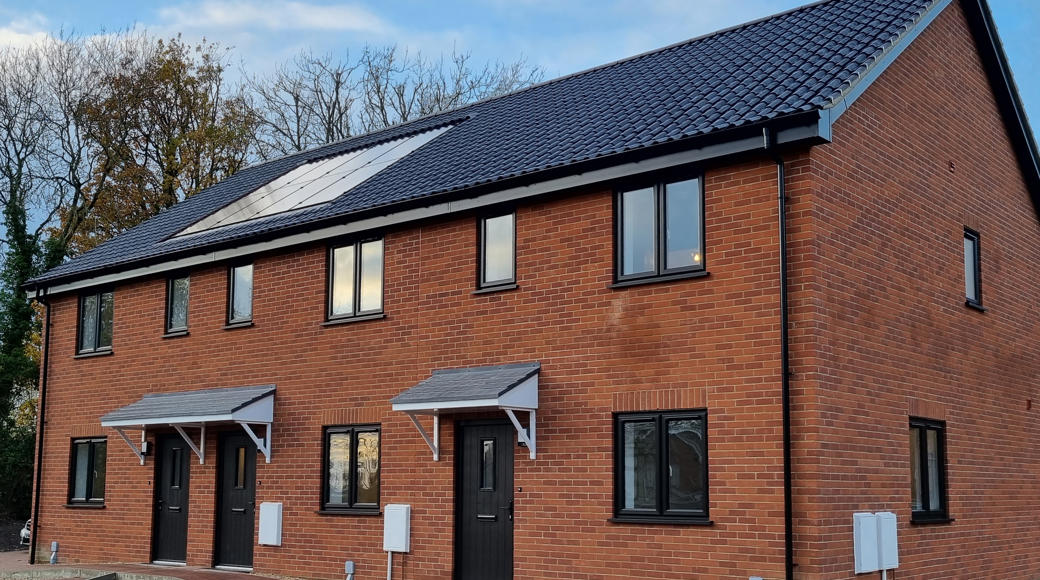 Row Of Three Newbuild Houses With Solar Panels