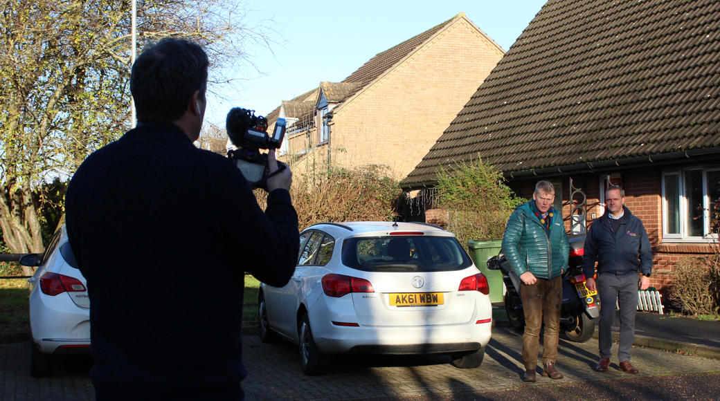 Presenter Tom Heap and Project Lead Richard Egle Being Filmed Outside House