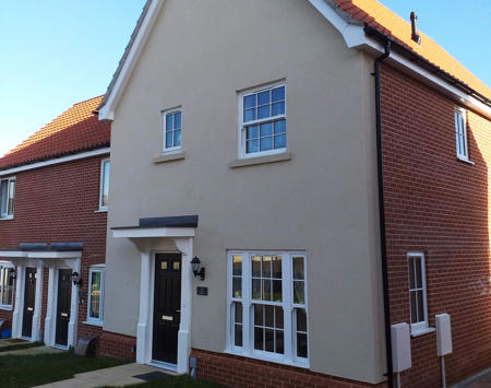 Cream Rendered House With Red Brick 