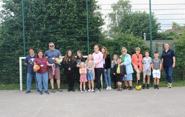 Wymondham Silfield Avenue Community Fun Day Attendees Lined Up By Goal Post