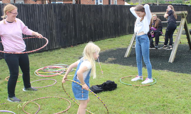 Community Fun Day Attendees Hula Hooping