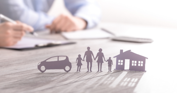 Paper Cut Cut Of A Car, Family And House Upright On A Table With Shadow