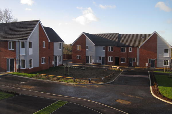 Group Of Houses In A Corner Of An Estate With Front Gardens