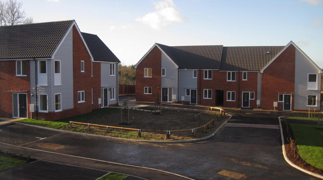 Group Of Houses In A Corner Of An Estate With Front Gardens