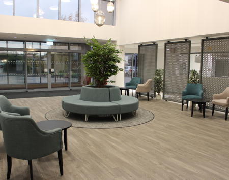 Entrance Area With Chairs, Tables And Indoor Tree