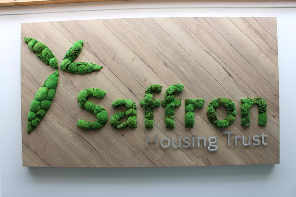 Saffron Logo In Moss Texture