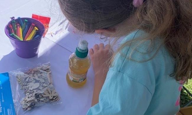 Child Colouring At Table