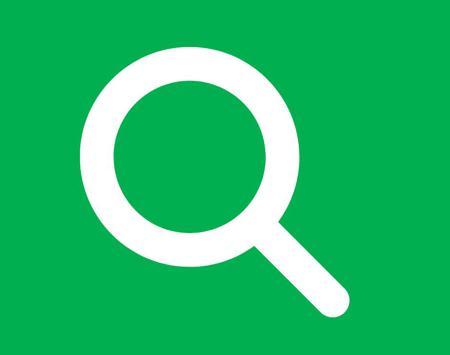 Green Background With White Magnifying Glass