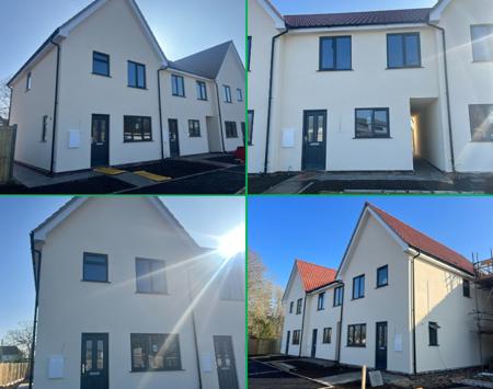 Row Of New White Modern Houses With Blue Sky