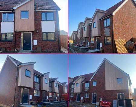 Row Of Modern Houses With Brick And Wooden Cladding