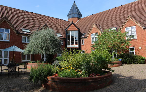 Red Brick Building Surrounded by Trees