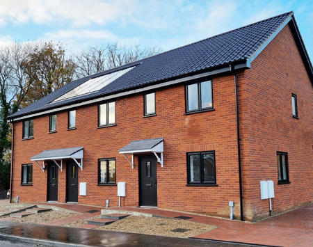 Red Brick House With Black Door